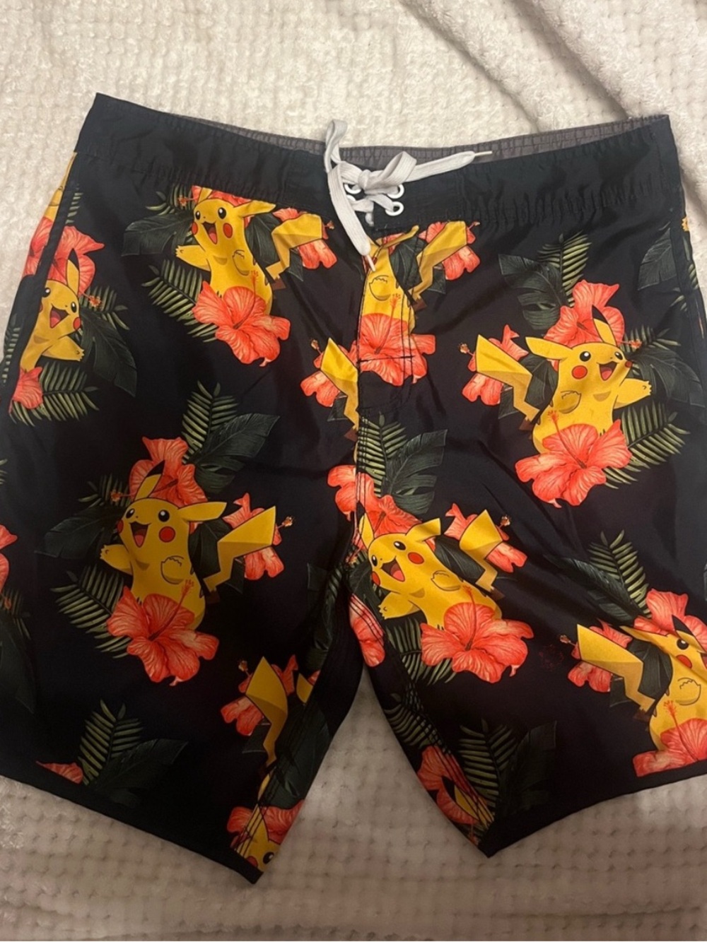 Pokemon Black Swim Shorts with Yellow Pikachu and Coral Floral Print